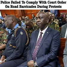 A judge seated in a courtroom during a legal proceeding.