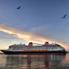 A cruise ship traveling across open sea