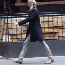A person walking with one notably long step