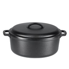 A cast-iron Dutch oven with its lid beside it.