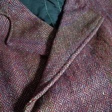 Close-up of a visible line of stitching sewn along the outside of a garment.
