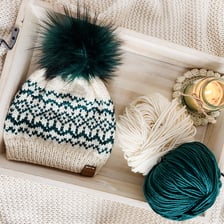 Several knitted beanies shown as winter hats.