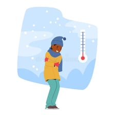 Person dressed warmly outdoors in visibly cold weather