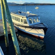 A passenger ferry traveling along a regular harbor route.