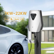 A Tesla electric car connected to a charging station.