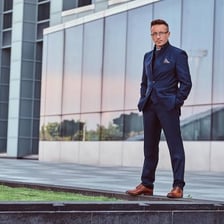 A fully dressed person wearing formal clothing.