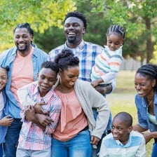 An aunt pictured with her nephews at a family gathering.