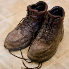 Large, heavy work boots illustrating the literal sense of clodhopper.