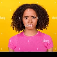 A person displaying a sullen, pouting expression