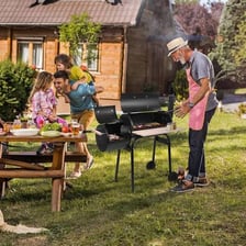 Outdoor barbecue grills arranged on a residential patio