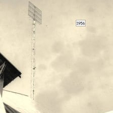 A television antenna positioned to improve a weak, snowy broadcast signal.