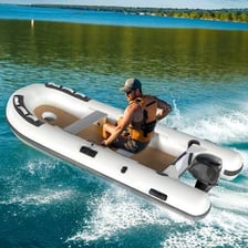 A small inflatable dinghy floating on the water.