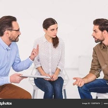 Two people having a serious conversation in which one speaker is notably direct.