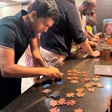 A person concentrating while solving a challenging puzzle.