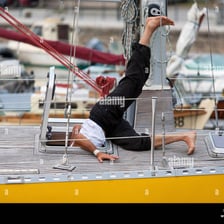A person caught in the act of tripping and falling forward.