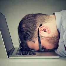 A person appearing drowsy and close to falling asleep.