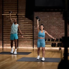 People exercising during workout sessions in a gym