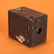 A vintage Kodak Brownie box camera.