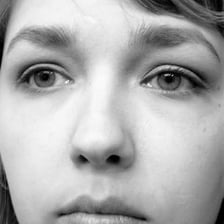 A person with a blank, unintelligent expression