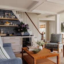 An interior decorator choosing furnishings and colors for a stylish room.