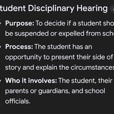 A school administrator meeting with a student about a suspension
