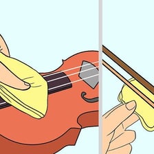 A person rubbing a block of rosin along violin-bow hair.