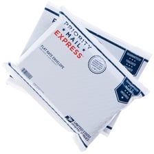 A package prepared for overnight delivery by an express shipping service.