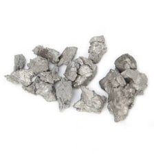 A silver-gray sample of zirconium metal.