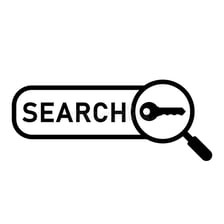 A person entering a search term into an internet search bar