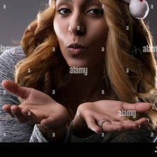 A person displaying a playful, shy, flirtatious expression.