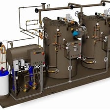 Metal steam pipes connected to an industrial boiler