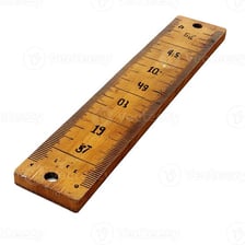 A ruler placed alongside an object to measure its length.