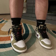 A pair of sneakers with loose, untied laces