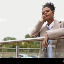 A person gazing into the distance with a wistful expression