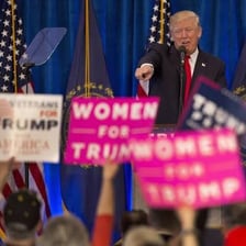 A political candidate speaking to supporters at a campaign rally.