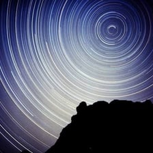Long-exposure view of stars circling the north celestial pole.