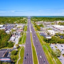 A broad multi-lane interstate highway extending into the distance.