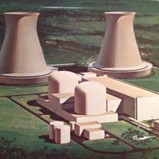 A nuclear power plant with reactor buildings and cooling towers