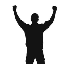A person raising their arms in celebration