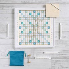 A Scrabble board with letter tiles forming words.
