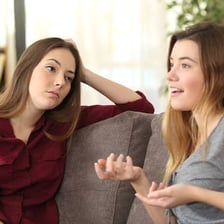 A person hearing someone speak nearby.