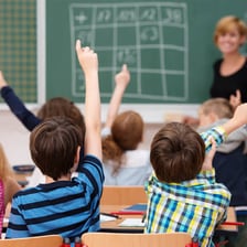 A group of students studying in a classroom.