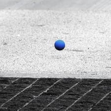 A rubber ball captured while bouncing off a surface.