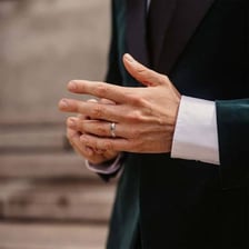 An engaged man wearing an engagement ring