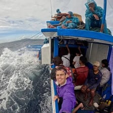 A passenger looking ill while travelling on a boat