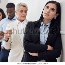 A visibly restless person waiting in a queue