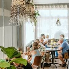 A familiar customer seated in a café.