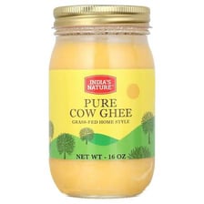 A jar of golden ghee, the clarified butter used in Indian cooking.