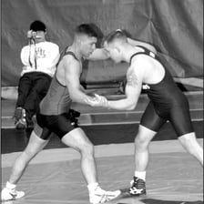 Two wrestlers demonstrating an armlock hold