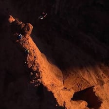 A person keeping watch in a dark setting